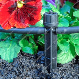 In-line pressure compensating dripper on stake