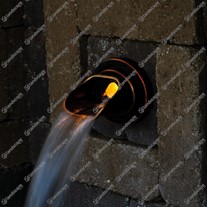 Ellipse copper wall spout in-situ (with lighting)