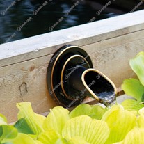 Bronze circular wall spout in-situ
