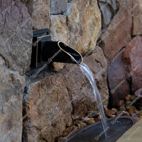 Bronze circular wall spout in-situ