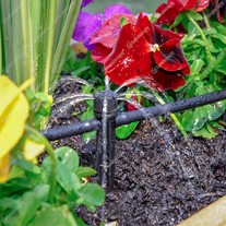 Adjustable in-line dripper on stake